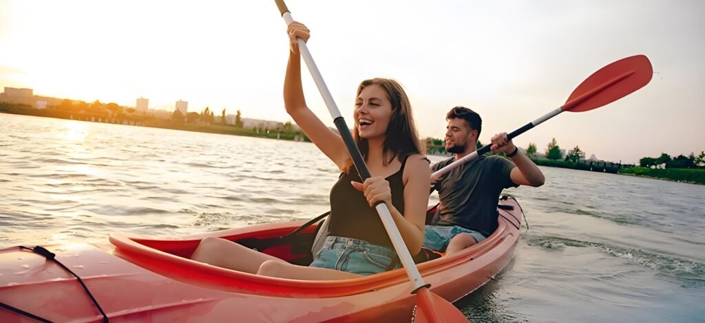 A couple kayaking on a calm lake, highlighting adventurous second date ideas.