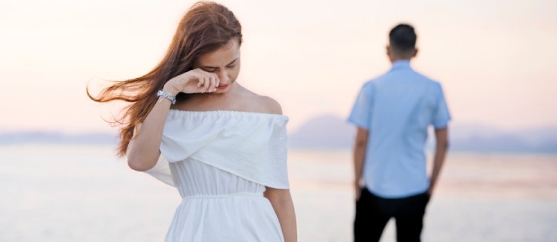 A couple walking through a park, reflecting trust-building in dating after divorce.