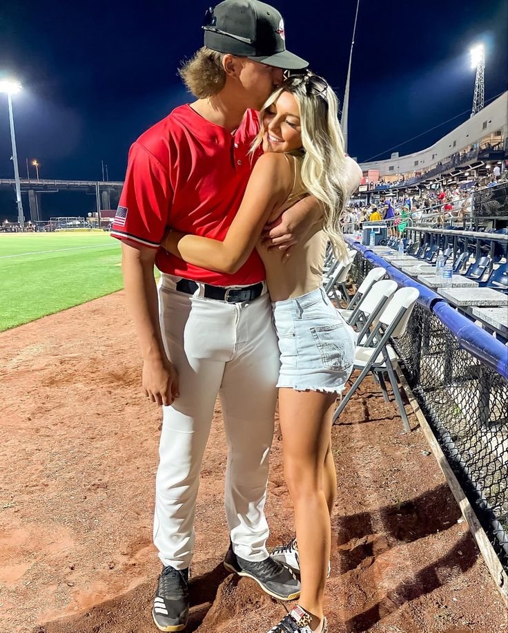 A couple sharing a kiss, symbolizing the first base in dating